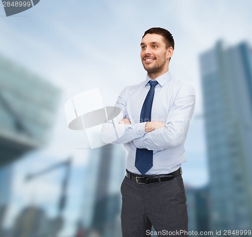 Image of handsome businessman with crossed arms