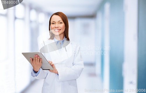 Image of smiling female doctor and tablet pc computer