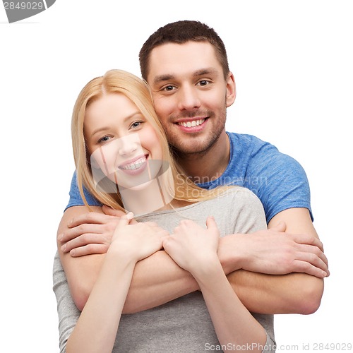 Image of smiling couple hugging