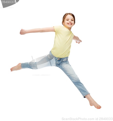 Image of smiling little girl jumping