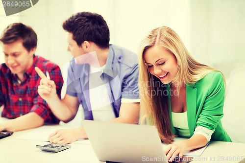 Image of students writing test or exam in lecture at school