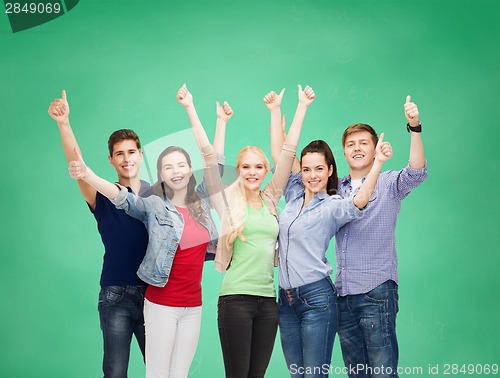 Image of group of smiling students showing thumbs up