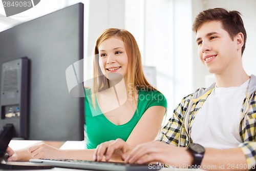 Image of two smiling students having discussion