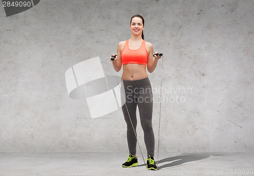 Image of sporty woman with skipping rope