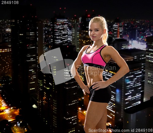 Image of beautiful athletic woman in sportswear