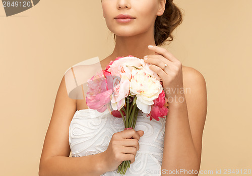 Image of woman with bouquet of flowers