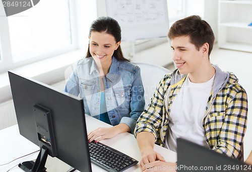 Image of two smiling students having discussion