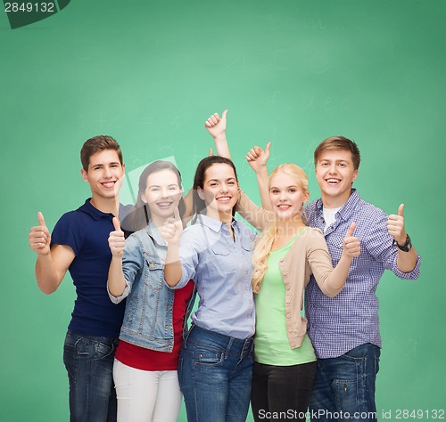 Image of group of smiling students showing thumbs up