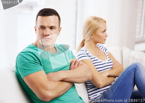 Image of unhappy couple having argument at home