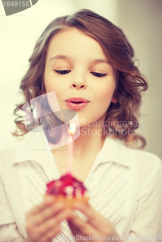 Image of girl with cupcake