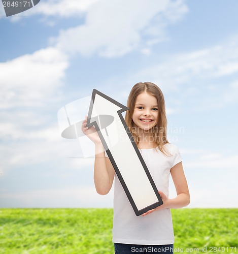 Image of smiling little girl with blank arrow pointing up