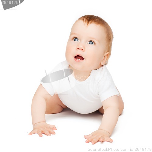 Image of crawling curious baby looking up