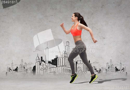 Image of sporty woman running in front of the city drawing