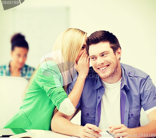 Image of group of students gossiping at school