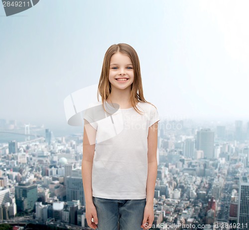 Image of smiling little girl in white blank t-shirt