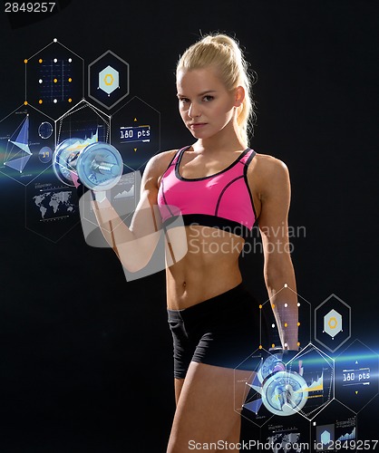 Image of sporty woman with heavy steel dumbbells