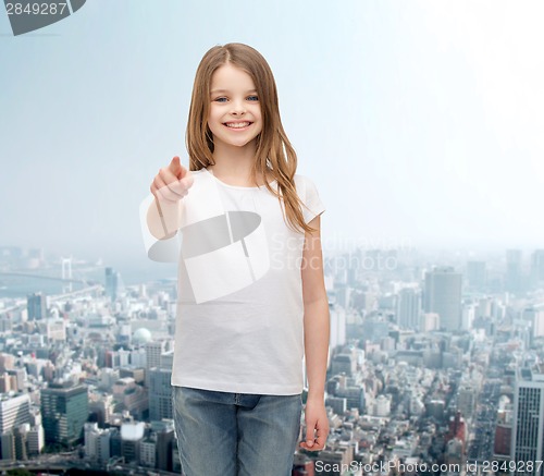 Image of little girl in blank white t-shirt pointing at you