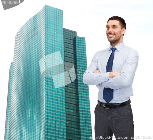 Image of handsome businessman with crossed arms