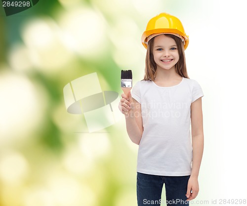 Image of smiling little girl in helmet with paint roller