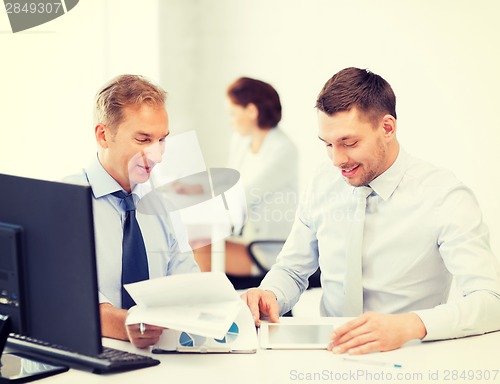 Image of businessmen with notebook and tablet pc