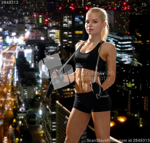 Image of sporty woman with skipping rope