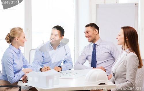 Image of happy team of architects and designers in office