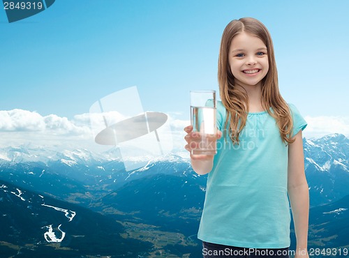 Image of smiling little girl giving glass of water