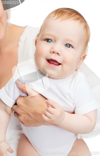 Image of close up of mother holding smiling baby