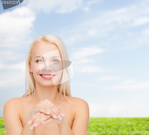 Image of face and hands of beautiful woman