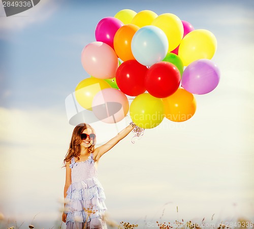 Image of happy girl with colorful balloons