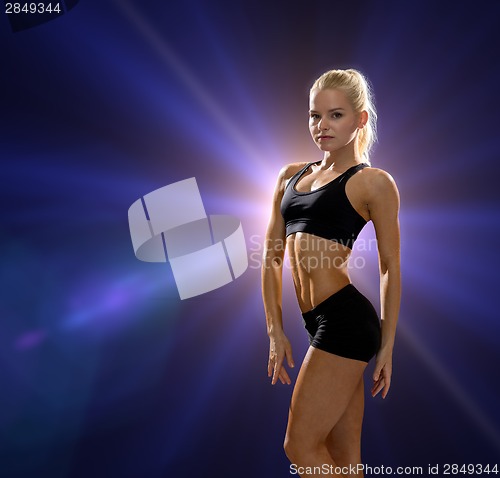 Image of beautiful athletic woman in sportswear