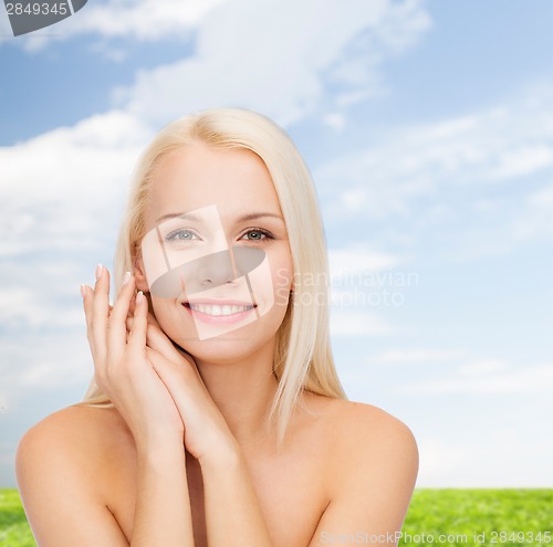 Image of face and hands of happy woman