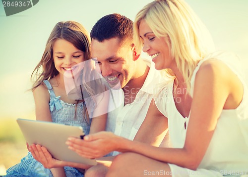 Image of happy family with tablet pc taking picture