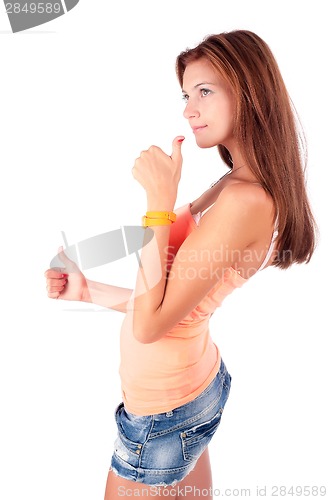 Image of Attractive girl with freckles shows thumbs up