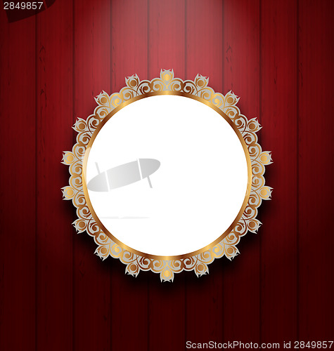 Image of Ornate picture frame on wooden wall 