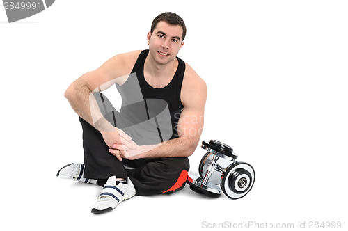 Image of young man posing with dumbbell