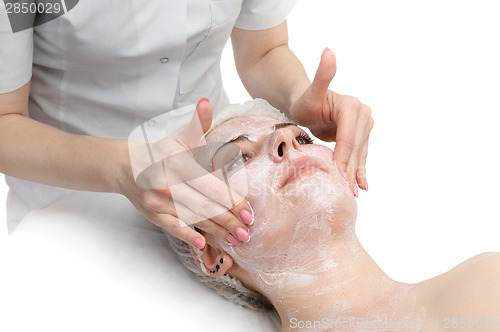 Image of facial massage with scrub mask 