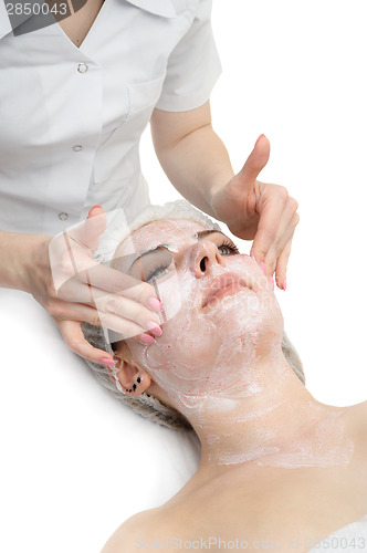 Image of facial massage with scrub mask 