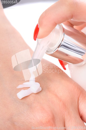 Image of hands skin care - cream applying