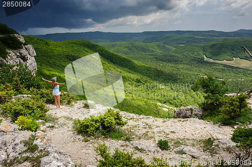 Image of Young woman against the storm