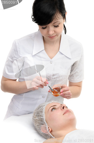 Image of facial peeling mask applying