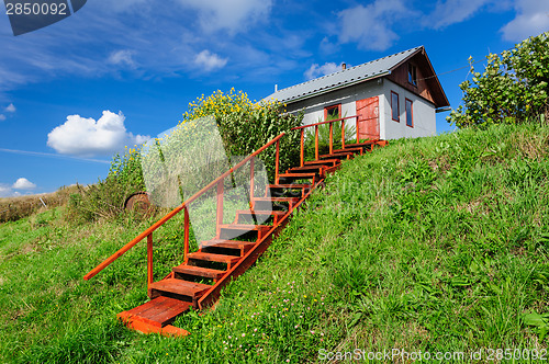 Image of Village house at hill, with stairs