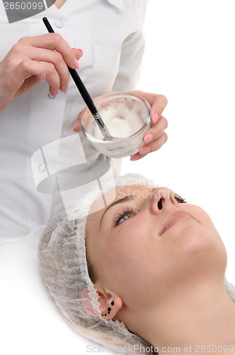 Image of beauty salon, facial mask applying