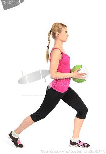 Image of Girl doing lunges exercise with medicine ball 