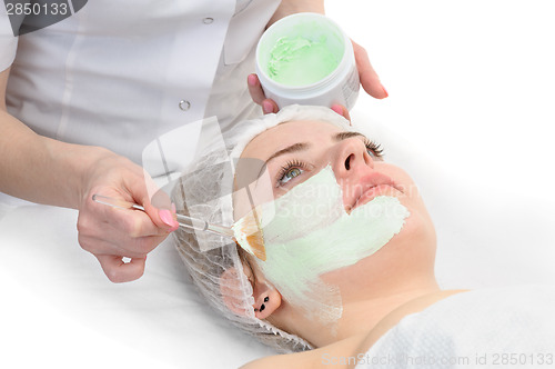 Image of beauty salon, facial mask applying