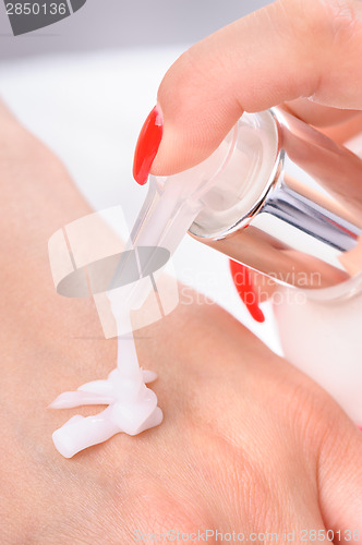 Image of hands skin care - cream applying