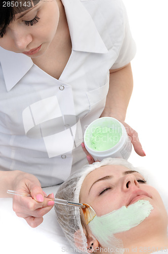 Image of beauty salon, facial mask applying