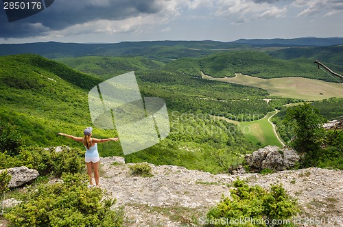 Image of Young woman against the storm