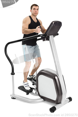 Image of one man doing step machine exercise