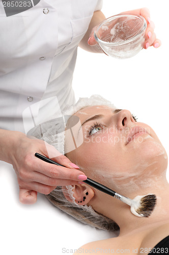 Image of beauty salon, facial mask applying